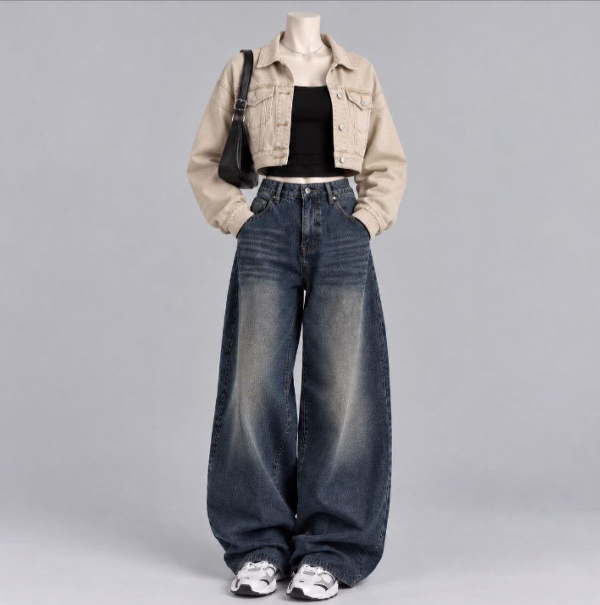 BEIGE DENIM JACKET WITH BLACK TANK TOP AND DARK BLUE FADED JEANS