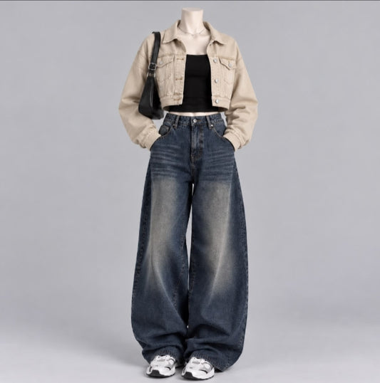 BEIGE DENIM JACKET WITH BLACK TANK TOP AND DARK BLUE FADED JEANS