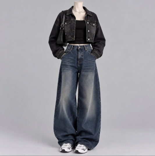 BLACK DENIM JACKET WITH BLACK TANK TOP AND DARK MID BLUE FADED JEANS